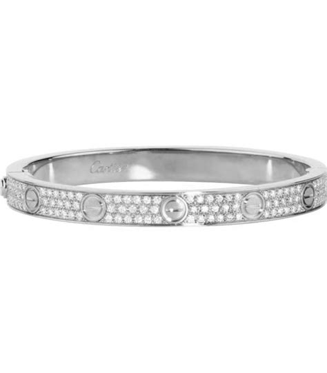 silver cartier bracelet with diamonds.